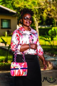 Ladies Formal Floral Top And Handbag With Matching Black Dress